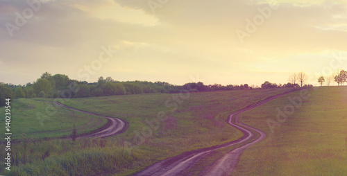 Two roads among the meadows