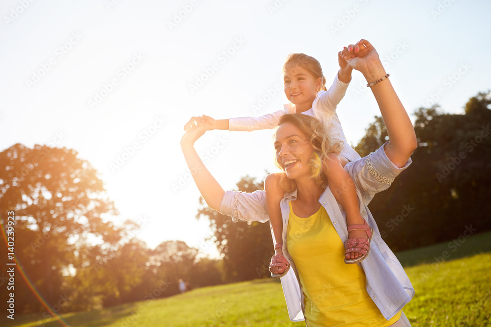 Fototapeta premium Mother with daughter enjoying in nature