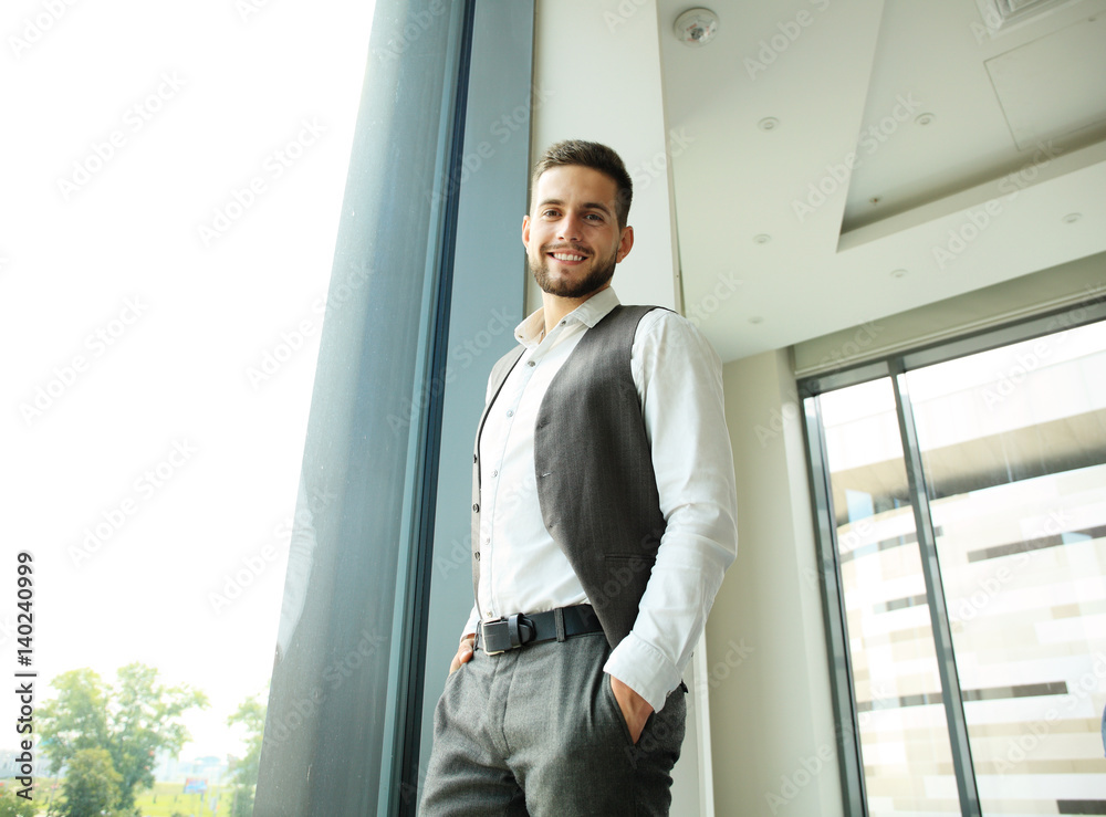 Portrait of a businessman looking at the window. Portrait of a businessman looking at the window.