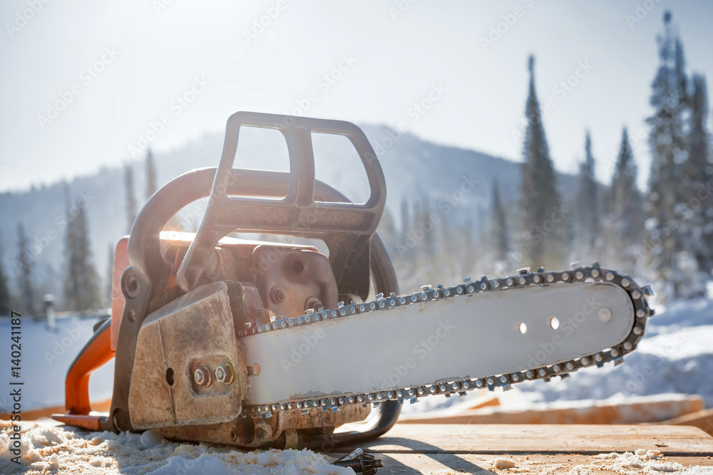 Chainsaw. Logging. StockFoto Adobe Stock