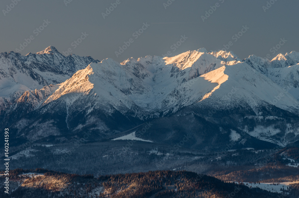 Beautiful winter panorama over Spisz highland to snowy Tatra mountains in the morning, Poland