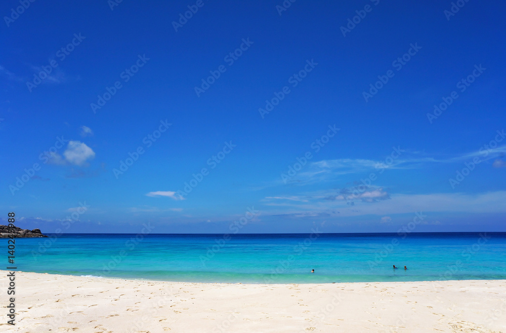 Scenic seascape of azure transparent ocean water and blue sky. Tropical beach with white sand. Idyllic scenery of seaside resort. Exotic travel destination for holiday and vacation