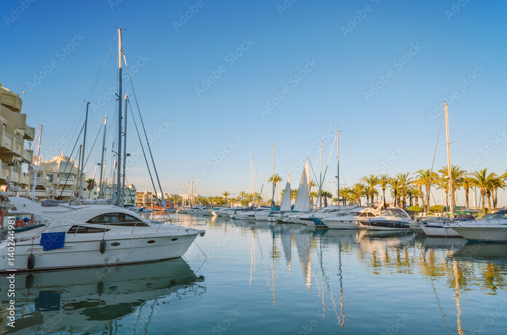 Fototapeta premium Yatchs in Marina port at dusk in Benalmadena, Malaga, Spain.