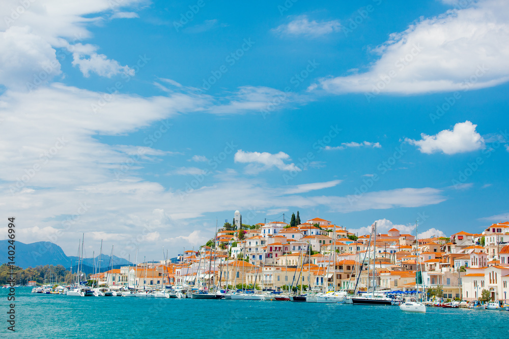 POROS, GREECE - JUNE 08, 2016: a beautiful view of the wonderful port city on the sky background in Greece