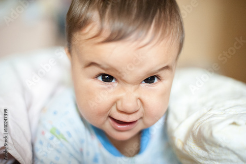 Portrait of little angry baby boy © Serenkonata