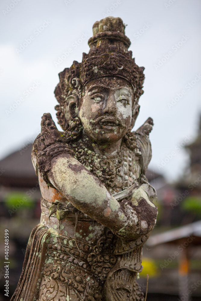 Stone sculpture on entrance door of the Temple in Bali