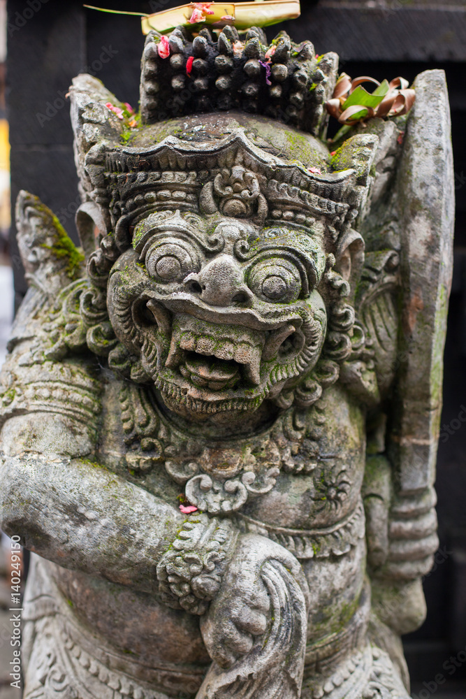 Stone sculpture on entrance door of the Temple in Bali