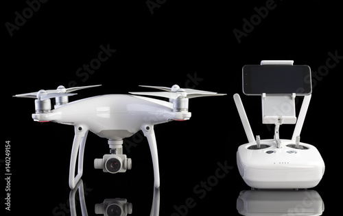 White drone against black background.