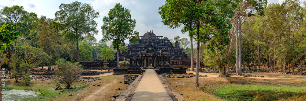 Baphuon Temple in Angkor Complex, Siem Reap, Cambodia. It is three-tiered temple mountain and dedicated to the Hindu God Shiva. Ancient Khmer architecture and famous Cambodian landmark, World Heritage