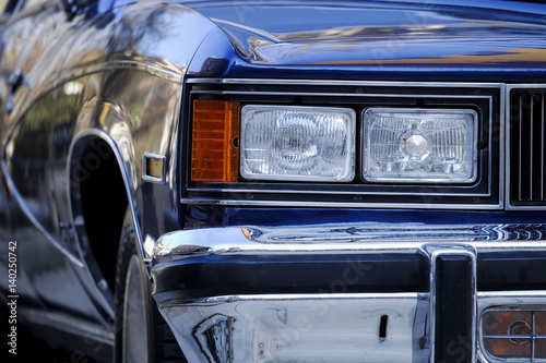 Front View and Headlight Detail of A Classic American Car
