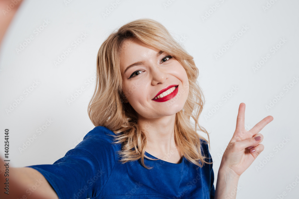 Amazing young lady make selfie with peace gesture Amazing young lady make selfie with peace gesture