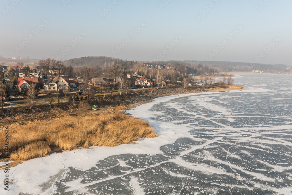 Obraz premium aerial view of the frozen lake near Nysa city