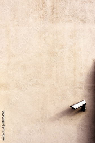 Abstract photograph of a CCTV camera which is fixed onto an outside wall of a building which is in London, United Kingdom