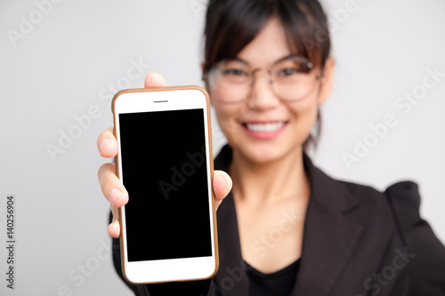 Asian women show blank screen of cellphone