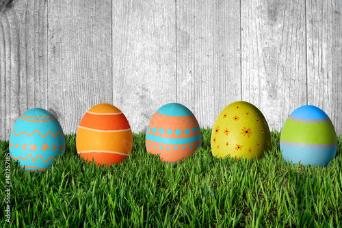 Easter eggs in green grass. Happy Easter.