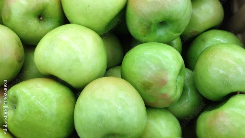 Camera trucks over vibrant green apples Camera trucks over vibrant green apples