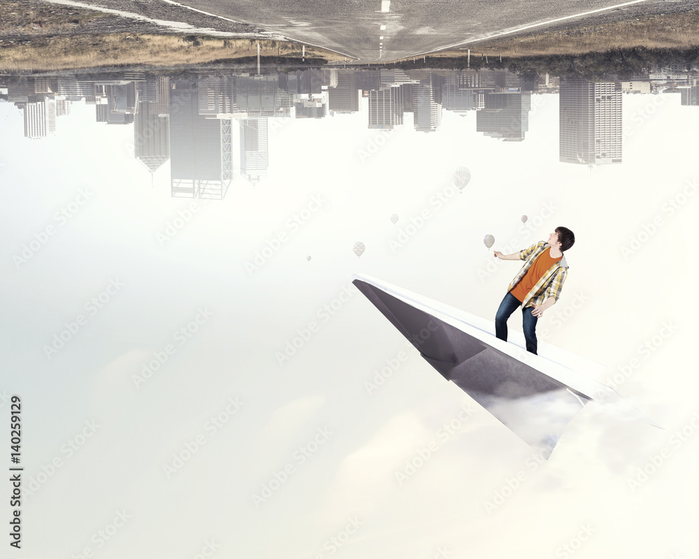 Obraz premium Hipster guy surfing sky . Mixed media
