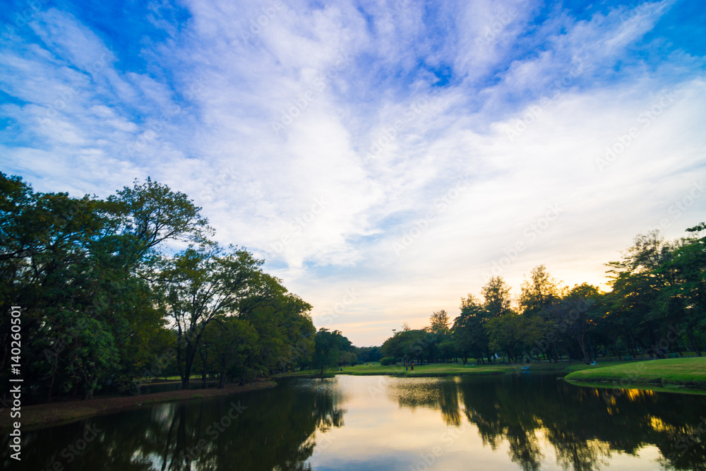 Park with pond sunset colourful sky