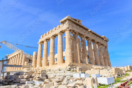 Parthenon on the Acropolis of Athens in summer, Greece. Ancient Greek Parthenon is the main landmark of Athens. Beautiful view of the famous temple ruins on the top of hill in Athens center.