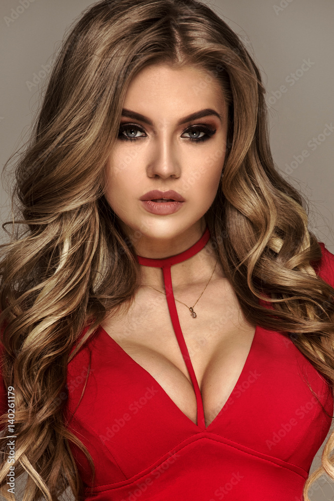 Fashionable blonde girl in red dress. Fashionable blonde girl in red dress.