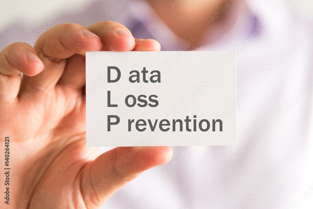 Businessman holding a card with DLP Data Loss Prevention message