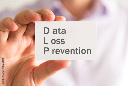 Obraz na płótnie Businessman holding a card with DLP Data Loss Prevention message w salonie