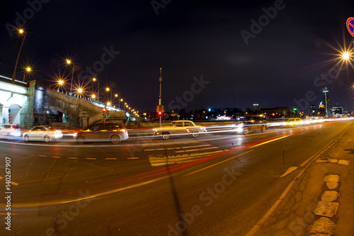 Urban city road with car light trails at night   