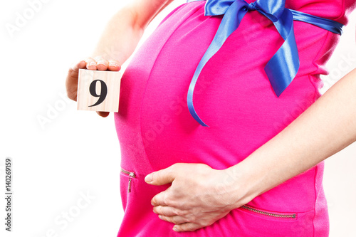 Wallpaper Mural Hand of woman showing number of ninth month of pregnancy, expecting for newborn concept Torontodigital.ca