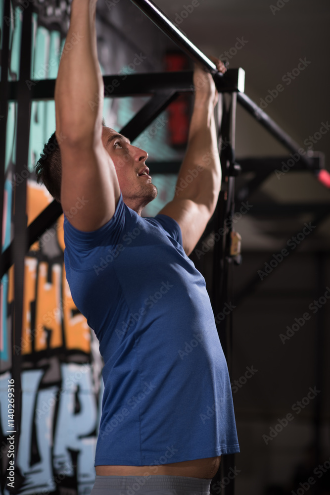 man doing pull ups man doing pull ups
