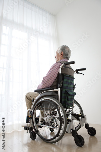 Senior man in wheelchair photo