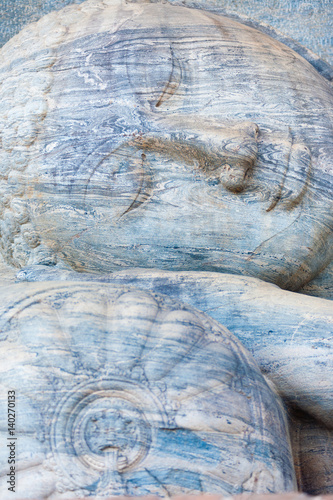 Wallpaper Mural Closup Head of Reclining Buddha Statue at Polonnaruwa Ruins in Sri Lanka. Vertical Torontodigital.ca