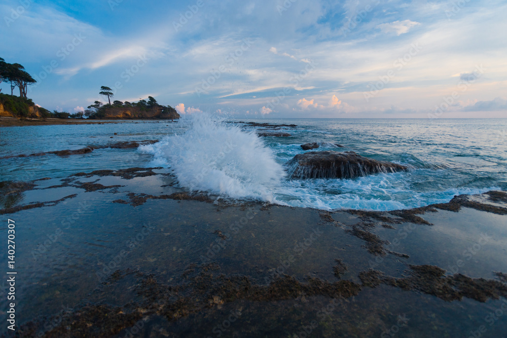 Fototapeta Wave Breaking at Tide Pool during Evening Sunset on Neil Island of Andaman Islands in India