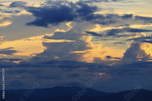 sky in sunset and cloud colorful twilight time with mountain silhouette, art beautiful in nature