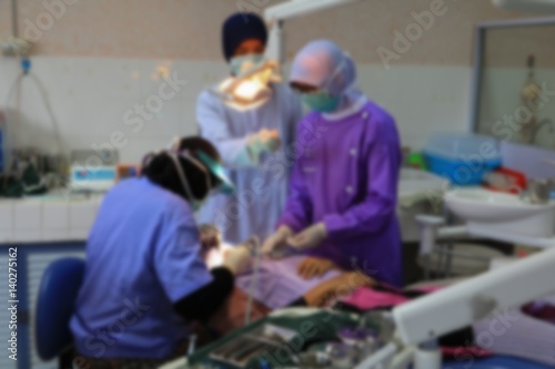 blurred focus with dentist in dental patient medical