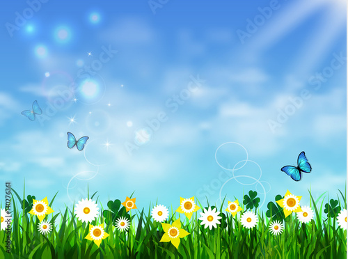 Green grass lawn with sunrise on blue sky