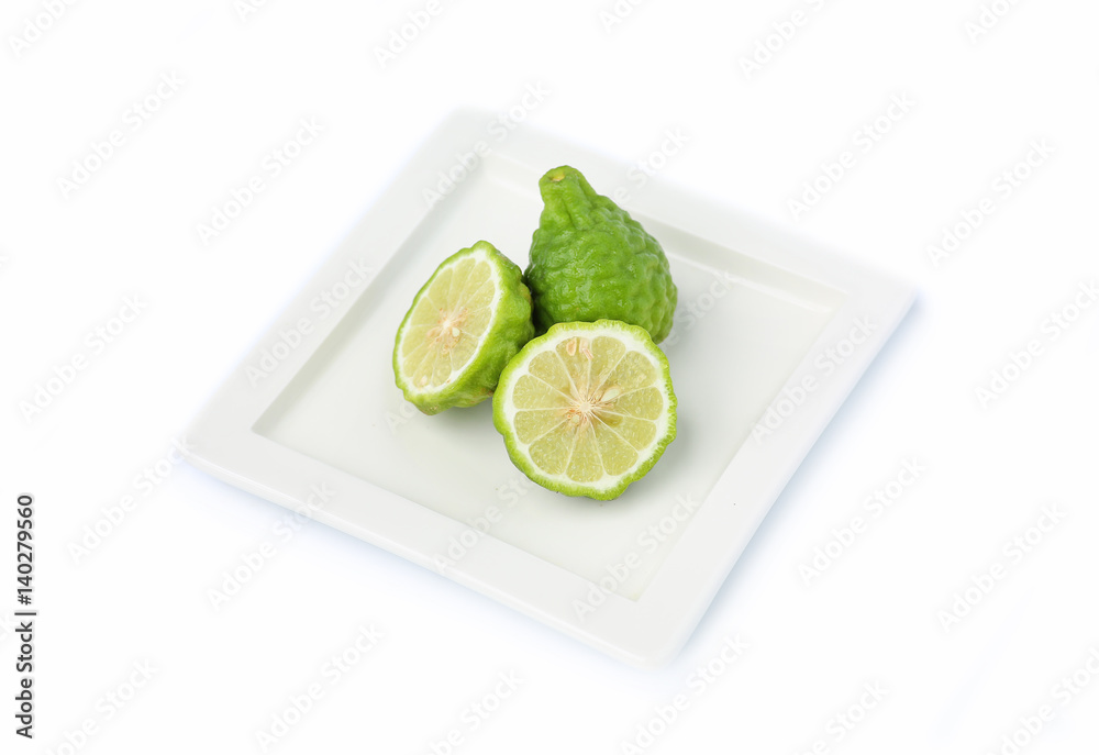 Bergamot fruit in square plate on white background Bergamot fruit in square plate on white background