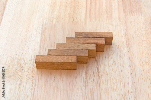 Wood block stacking as step stair. Business concept for growth success process.