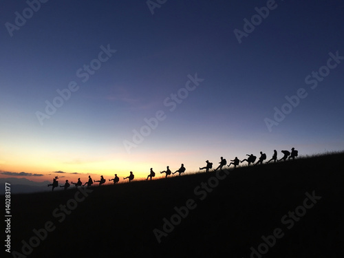 Silhouettes of my friendship who spent time on the mountain in the beautiful sky at the sunset. at Doi Monjong  Thailand