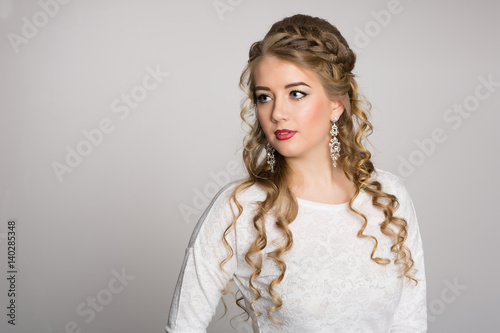 Portrait of a pretty girl with a fashionable hairstyle