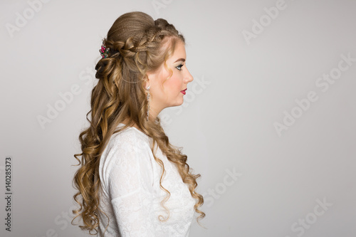 Portrait of a girl with a fashionable hairstyle in profile