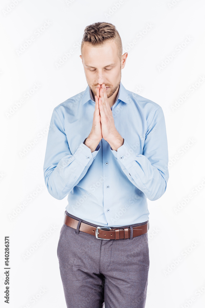 bearded business man praying with hands. human emotion expression and lifestyle concept. image on a white studio background.. bearded business man praying with hands. human emotion expression and lifestyle concept. image on a white studio background..