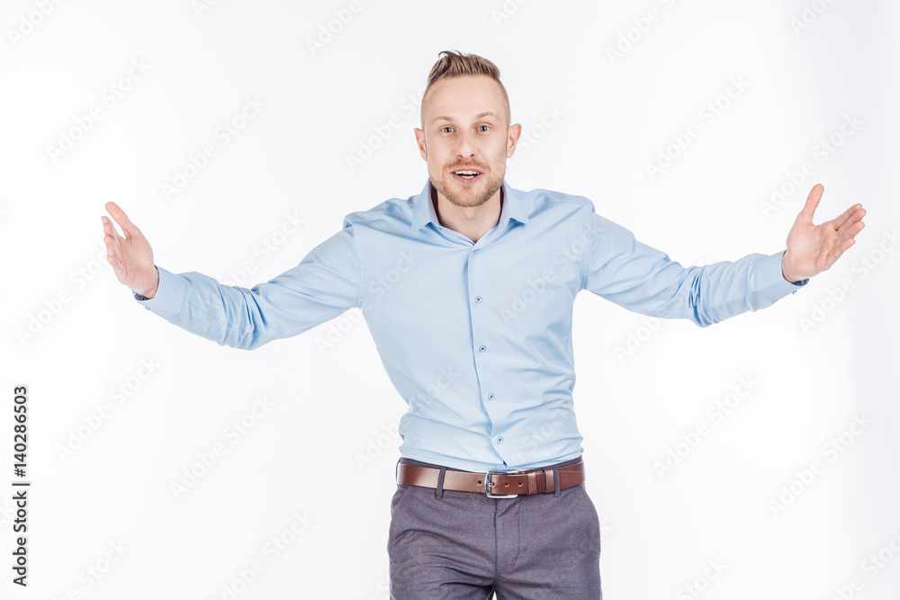 man holding two hands in front of him and shows the size on white isolated background in studio. man holding two hands in front of him and shows the size on white isolated background in studio.