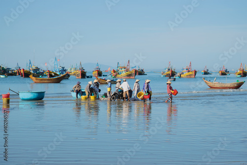 Blue morning in the harbour of the fishing village of Mui Ne. South Vietnam photo