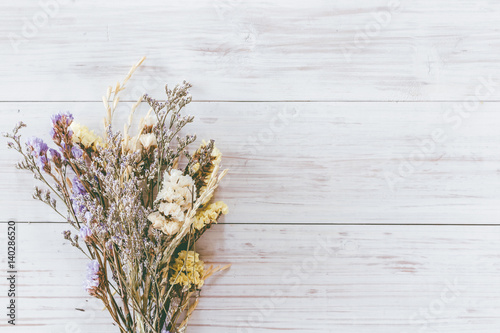 Dried flower on wooden background