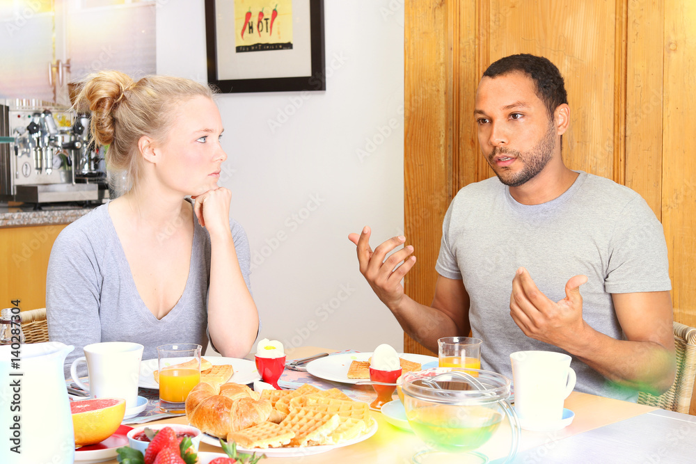 Couple arguing during breakfast Couple arguing during breakfast