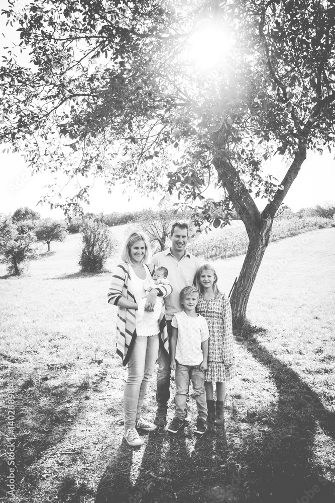 happy young family with 3 children outdoors happy young family with 3 children outdoors
