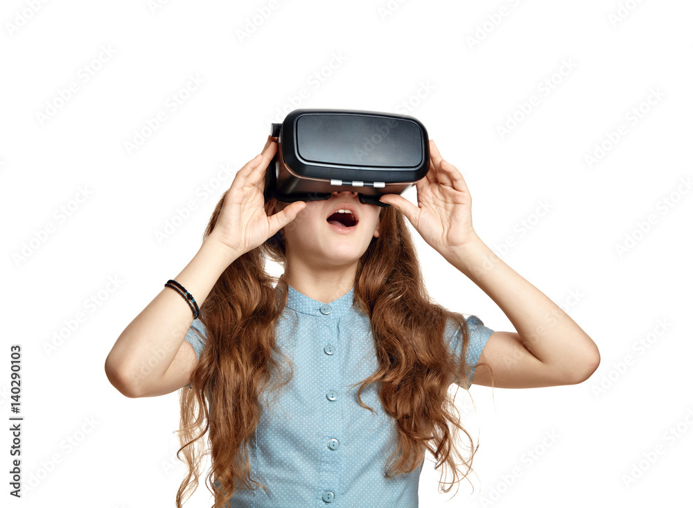 Young girl with virtual reality glasses isolated on white background. Young girl with virtual reality glasses isolated on white background.