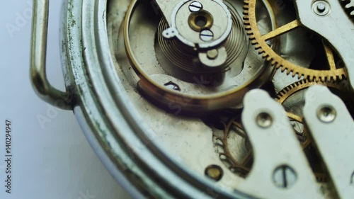Old vintage clock mechanism working, closeup shot with soft focus