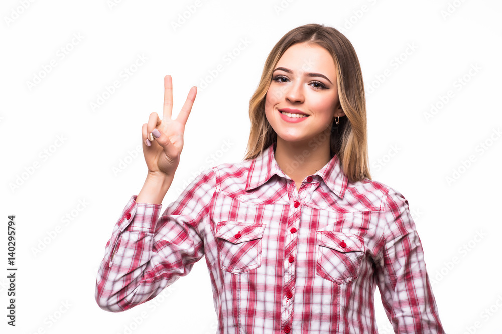 young smiling woman showing victory or peace sign young smiling woman showing victory or peace sign
