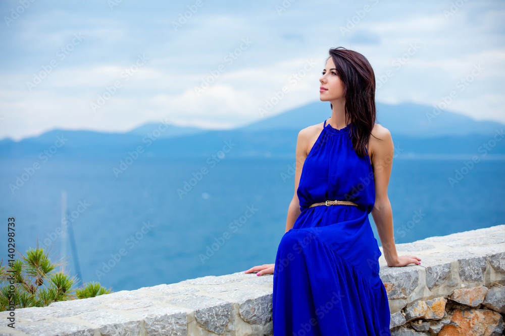 photo of beautiful young woman sitting on the stairs in Greece photo of beautiful young woman sitting on the stairs in Greece